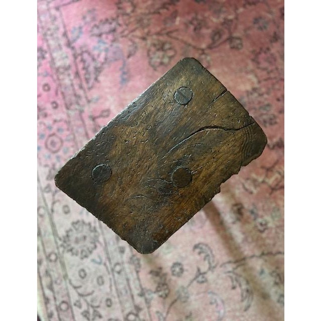Antique three-legged milking stool from England. Unique combination of Chestnut and Oak. Incredible patina and character.