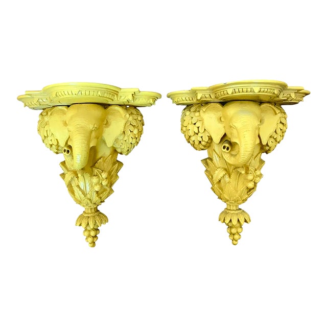 1970s Carved Wood Yellow Lacquer Elephant Wall brackets.A Pair For Sale