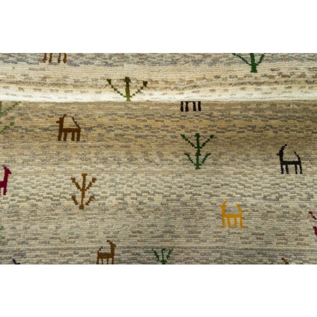 Cream Hand-Knotted Gabbeh Nomadic Rug with Natural Tones & Symbolism For Sale - Image 8 of 11