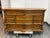 Design Plus Gallery presents a Traditional Carved Wood Dresser. This stately dresser displays oak grain throughout its...