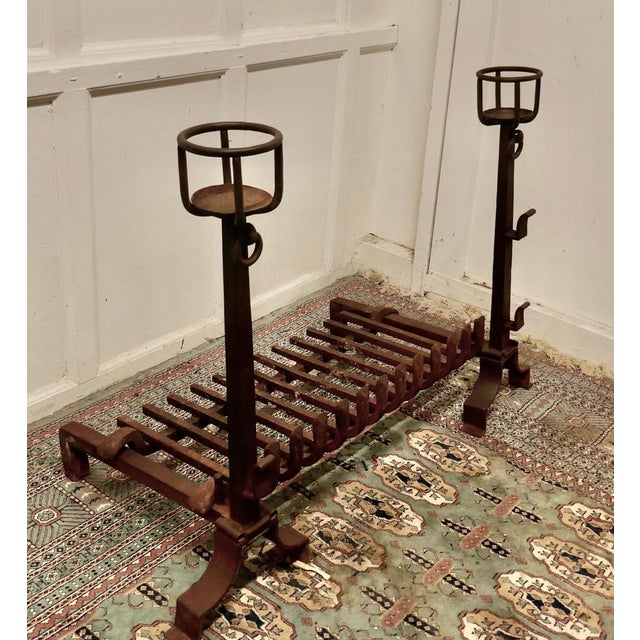 Very large early 19th century French fire grate set on iron fire dogs This is a very large fire grate set on tall bowl...