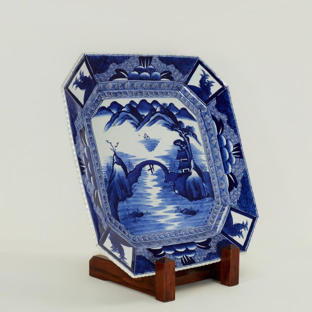 Impressive Japanese Meiji period charger handcrafted in porcelain in a stylized octagon form, hand decorated in cobalt...