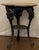 The base features three legs decorated with detailed figural masks. Made of heavy cast iron three splayed legs, joined by...