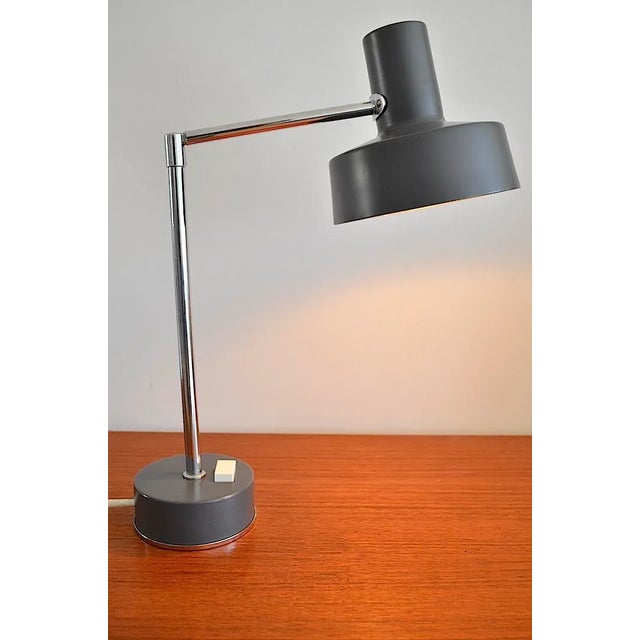 Mid-Century writing lamp of the Dutch company Philips, the head of the lamp is adjustable in the shaft. The lamp is in a...