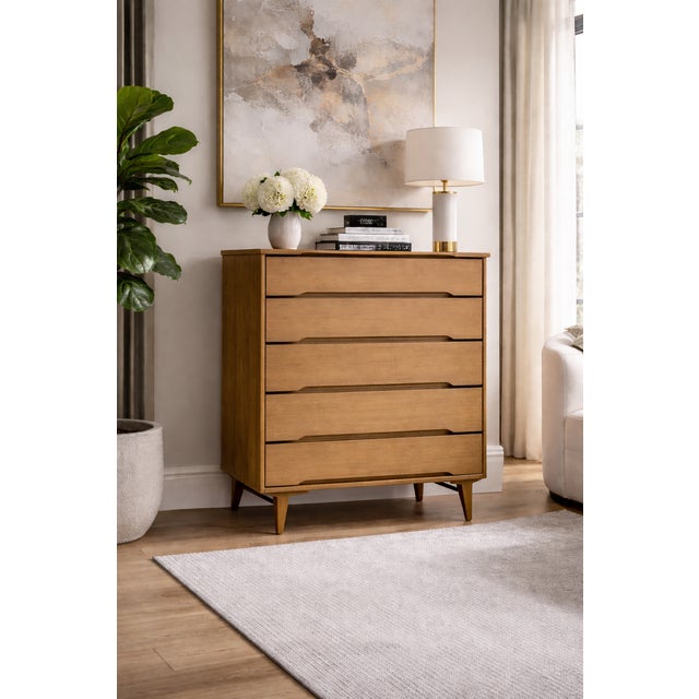 Classic Mid Century Modern American design from Stanley Furniture, c. 1960s, featuring sculpted integrated pulls, a warm...