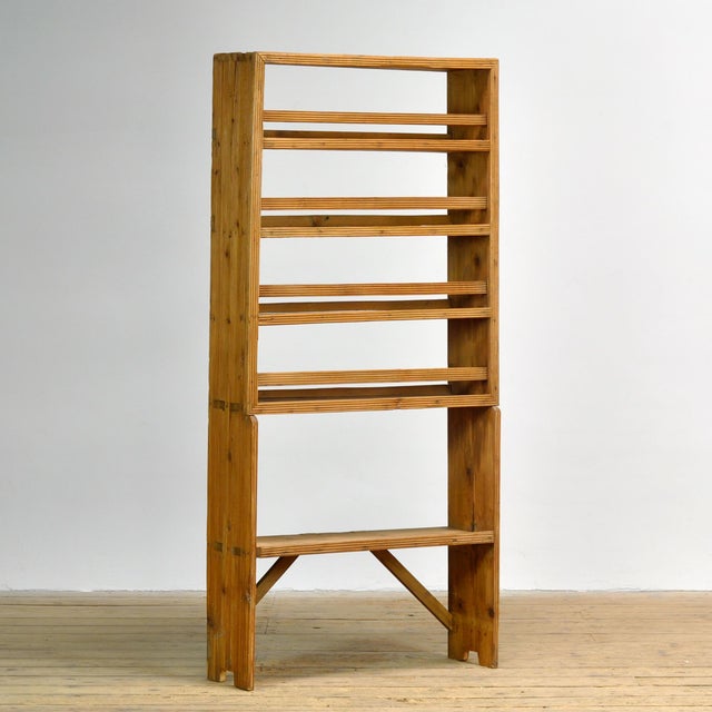 This open pine cabinet from circa 1930 is a charming and functional piece with a warm, authentic look. The cabinet...