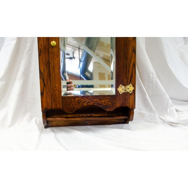 An oak wall-mounted cabinet for the kitchen (a spice cabinet?) or bathroom, or anywhere else needed. Behind the 16 1/2" x...