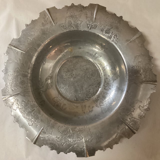 A vintage English decorative serving bowl from the mid 20th century. This lovely aluminum serving bowl from England has a...