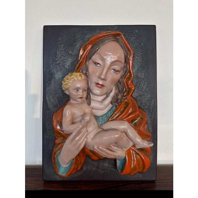 A stunning, highly collectible vintage ceramic wall relief depicting the madonna and child, beautifully handcrafted by the...