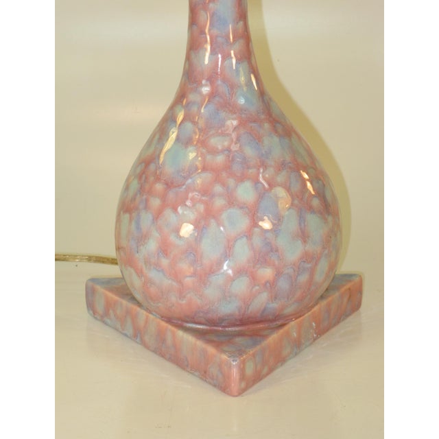 This Table Lamp features a unique geometric design with a pink and blue glaze ceramic body, embodying the Mid-Century...