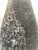 Crepax-designed artistic glass vase with a tapered and slightly asymmetrical shape, featuring a rounded body and tapered...
