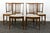 A good set of 4 Scandinavian / Danish Modern teak dining chairs. The chairs have a splay back with bannister type frame...