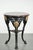 An antique English bistro/side table with a cast-iron base dates from the early 20th century and features a solid wood...