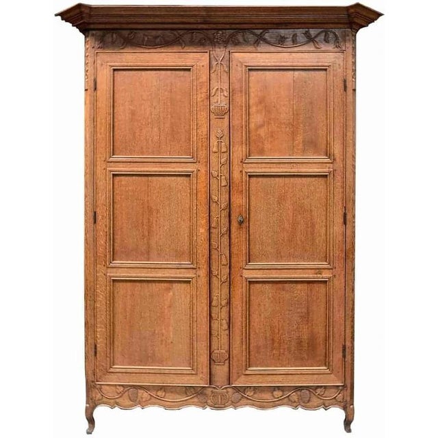 Hand-carved cabinet from the 18th century. Fine floral carving. Wardrobe with shelves inside. The joints are mortise,...