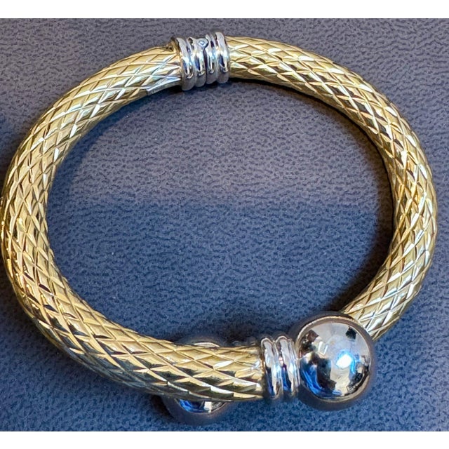 This exquisite vintage cuff bangle bracelet showcases two colors of gold elegant 18 karat solid yellow & White gold. The...