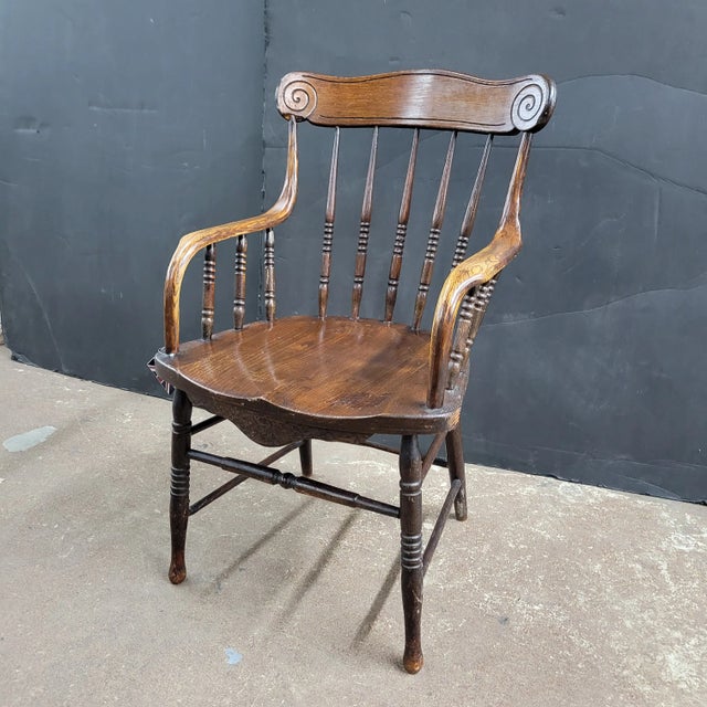 Elegant Edwardian oak arm chairs.