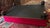 Cerise Custom Fuchsia Pink Velvet Cocktail Ottoman With Dark Wood Base & Bun Feet For Sale - Image 8 of 11