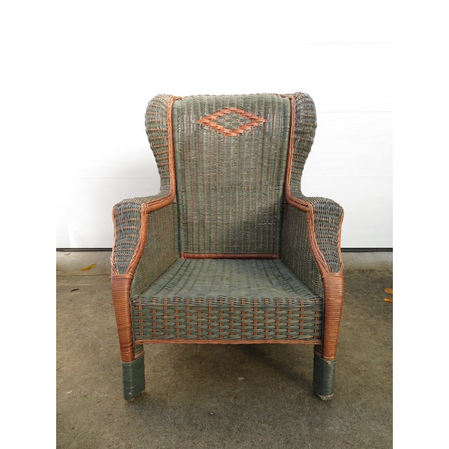 Very nice vintage rattan & wicker wingback arm chair by Palecek. This piece is solid, sturdy, and completely functional....