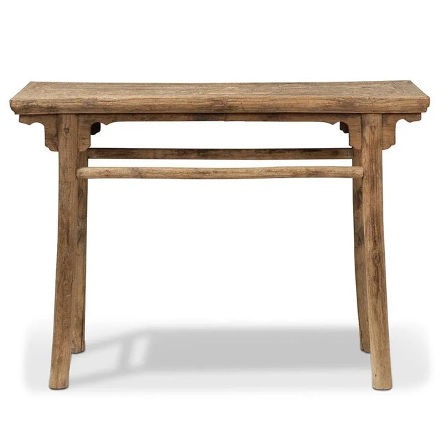 Dating back to around 1880, this antique elm table showcases traditional Chinese design with 'An' style recessed legs and...