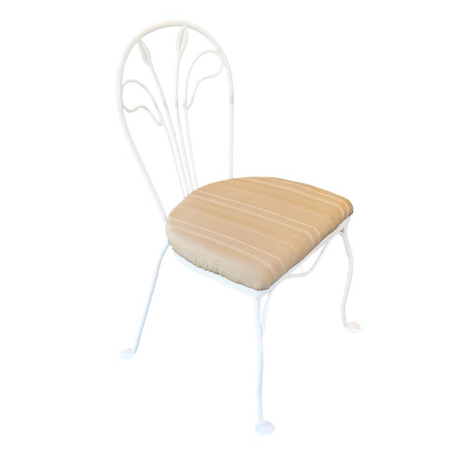 A vintage lot of 4 mid-century iron outdoor garden chairs newly restored in white finish. Fashion after French café chairs...