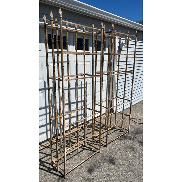 Fabulous pair of fine quality iron faux bamboo etageres. Each holds 6 thick glass shelves, which are 3/8" thick with...