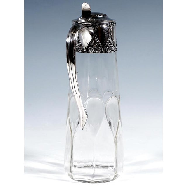 Exquisite cut Art Nouveau glass carafe with silver mount: Clear glass carafe with a conical body, featuring an all-round...