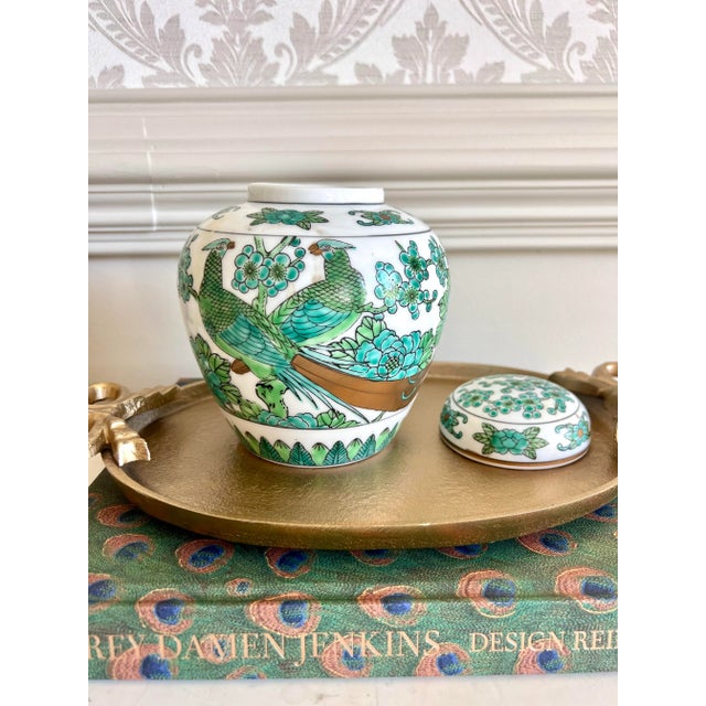 A striking mid-century Japanese Gold Imari porcelain ginger jar, hand-painted in an exceptionally rare green and turquoise...