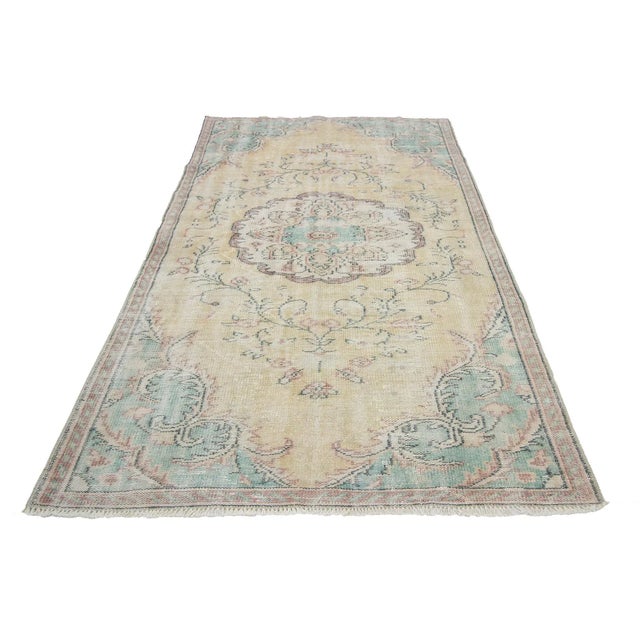 Washed Out vintage handknotted rug from Oushak region of Turkey. Approximately 50-60 years old. In very good condition