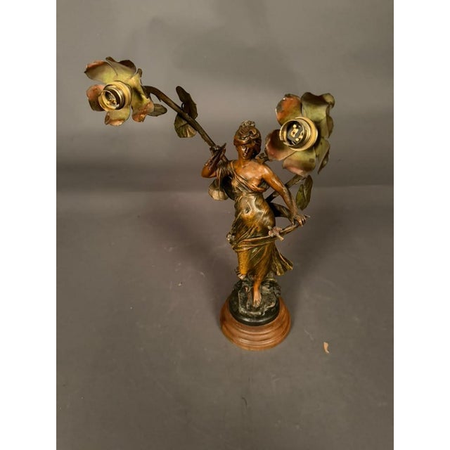 French statue table lamp after Moreau, dating to the early 20th century, circa 1920. The sculptural figure depicts a young...