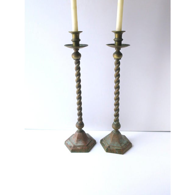 A chic pair of English brass barley-twist candlestick holders, Victorian-Edwardian design period, circa late-19th century,...