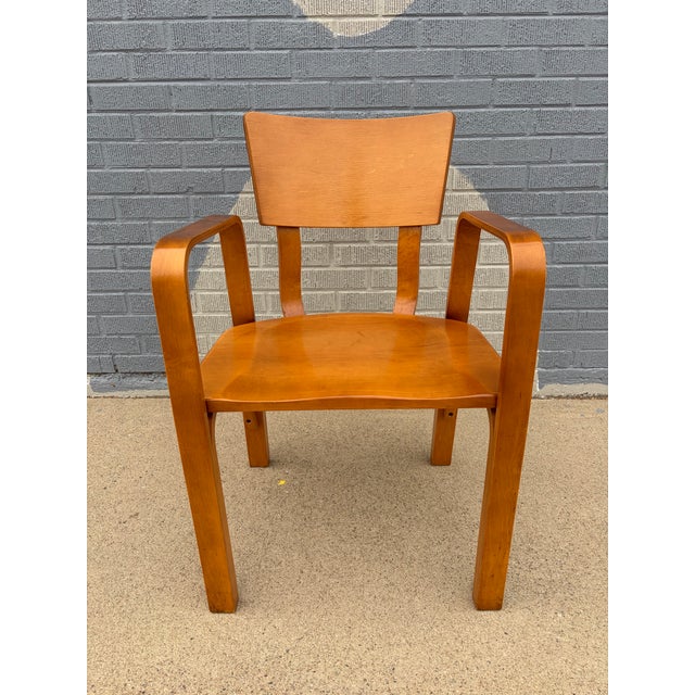 A classic Thonet bentwood side chair showcasing the iconic curves and craftsmanship that define early-to-mid 20th-century...