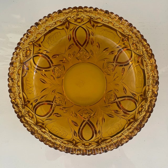 Vintage Dark Amber Colored Solid Glass Serving Bowl could be used for dining or for display. The sawtooth rim and...