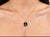 Modern 14K yellow gold pendant slide featuring a bold peace sign design with a black onyx center. Estate piece with sleek...