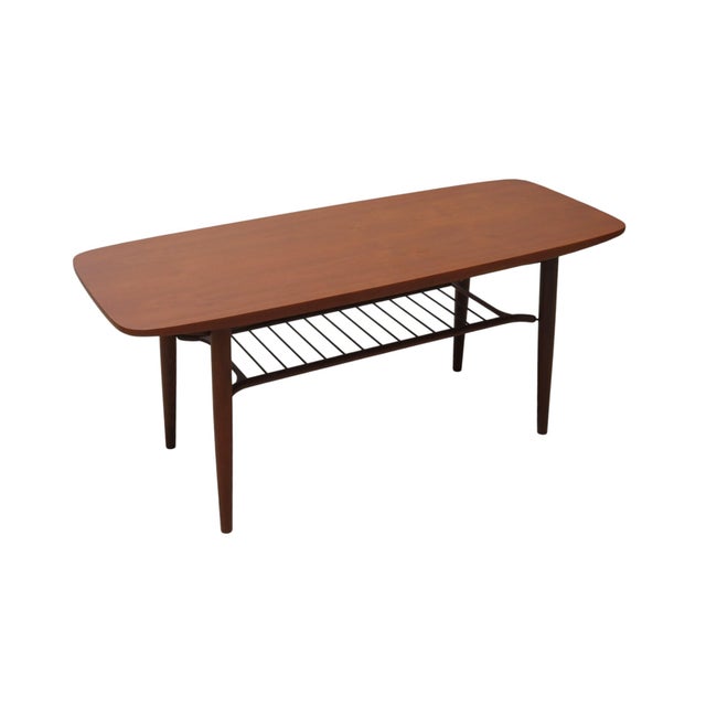 1950's Hyggebord 55 coffee table by Danish manufacturer Gorm Møbler. Made of teak with a rounded rectangular top and round...