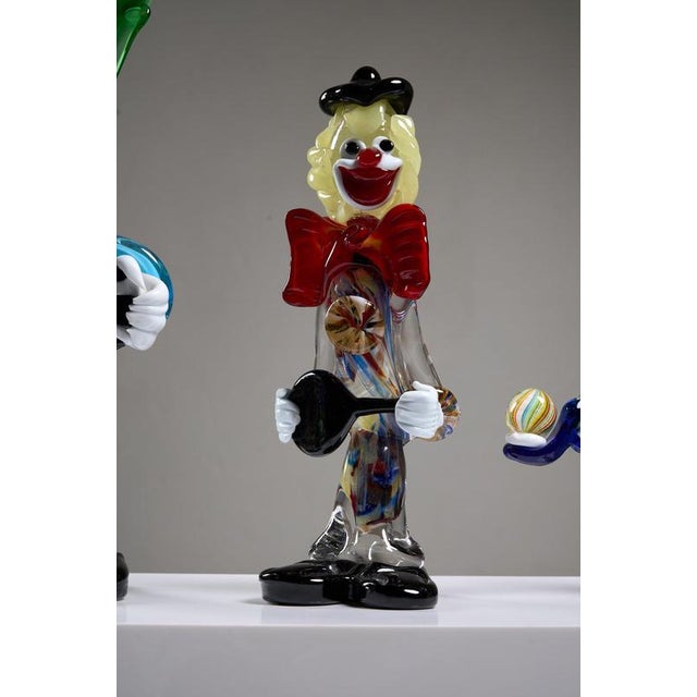 This set of five vintage Murano glass clown figurines is a representative collection of Italian art glass production from...