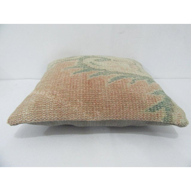 Decorative pillow cover made from a vintage Turkish handknotted rug. Backed with good quality cotton fabric. Pillow...