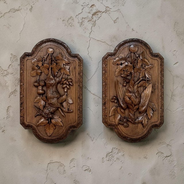 Pair 19th Century Country French Hunt Style Hand-Carved Oak Plaques is a striking pair executed on a generous scale and...