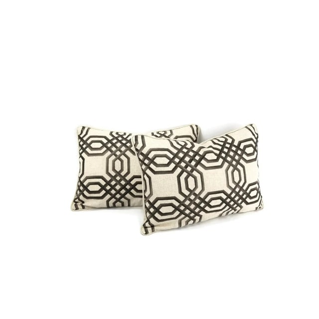 Stunning brown and dark brown embroidered threads in a geometric design on tan linen/polyester background. This pillow is...