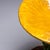 Italian ceramic side table from the 1960s, with a round glass tabletop. The table is made of green-yellow glazed ceramic...