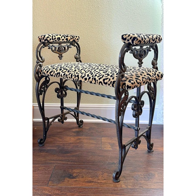 This is a charming 1930's Wrought Iron bench. This bench is upholstered in an unexpected leopard design print. This is an...