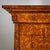 Biedermeier secretary with pyramidal case. The piece rests on plinth legs and features three drawers of varying heights in...