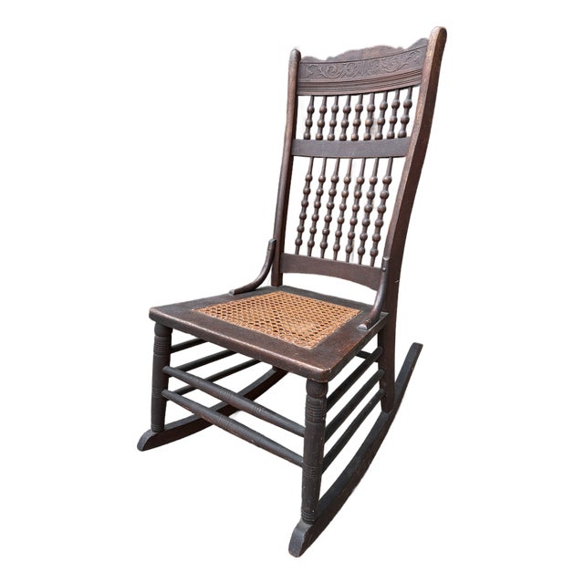 Early 20th/Late 19th Century Victorian Rocking Chair With Spindle Back and Cane Seat For Sale