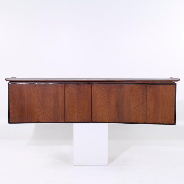 Harvey Probber Style Mid Century Walnut Wall Mounted Curved Credenza This credenza measures: 99.5 wide x 22 deep x 26...