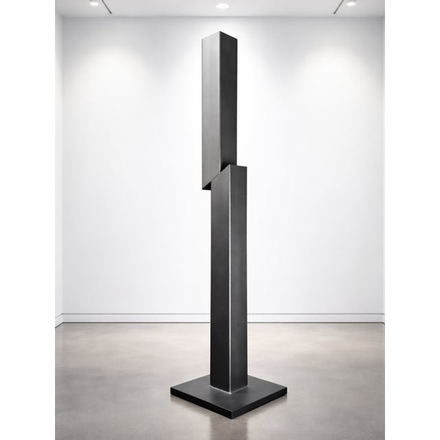 Severance is a contemporary steel sculpture by artist Nicholas Turner, defined by a singular vertical form interrupted by...