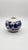 Hand-thrown stoneware bud vase featuring expressive cobalt blue brushwork over a warm speckled glaze. The rounded form and...