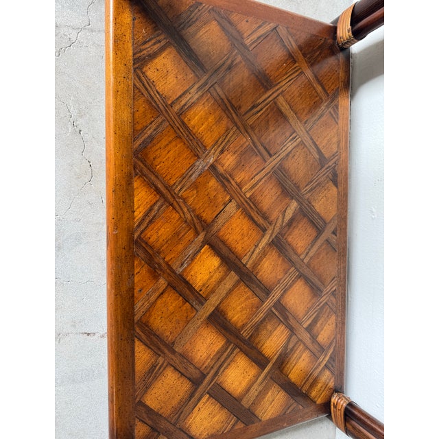 Striking 1970s Hollywood Regency four-tier étagère crafted in richly grained walnut with sculptural rattan-wrapped...