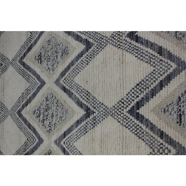 Hand knotted of top quality natural dyed wool and cotton in Afghanistan. This unique and innovative Navajo style Runner is...