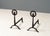 USA, ca. early 1900s. A handsome pair of hand forged Arts & Crafts andirons. Each features hammered iron construction with...