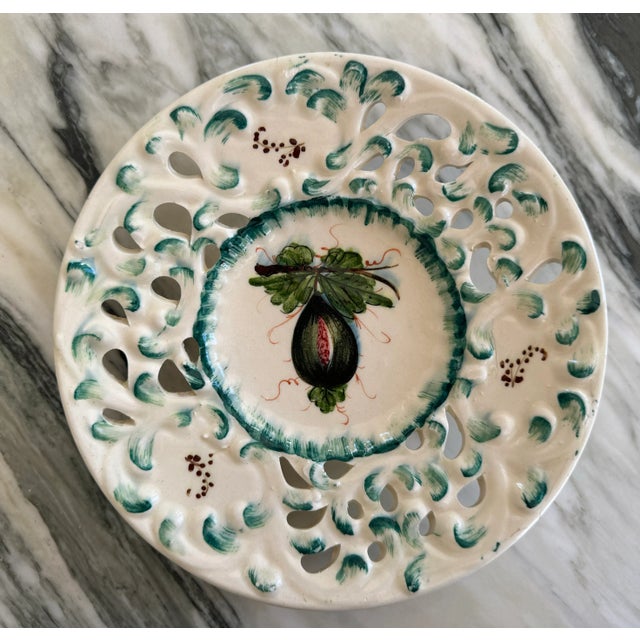 Here is a stunning hand painted and reticulated Italian decorative plate in plum/eggplant, cerulean, aqua and raspberry...