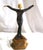 An elegant pose of a Lady figurine with out streached arms . Casting is metal with bronze finish , Total ht is at 14" ....